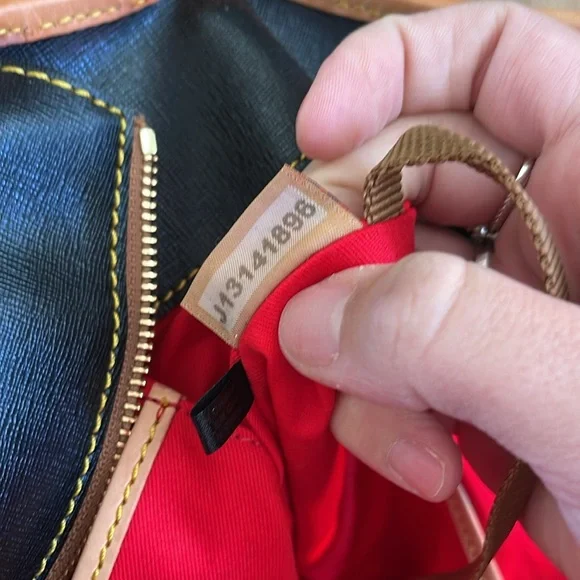 DOONEY & BOURKE Black and Tan Pebbled Leather Tassel Zip Top Tote Handbag